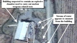 This April 9, 2012 photo provided by the Institute for Science and International Security, ISIS shows suspected cleanup activities at a building alleged to be used for nuclear weapon related tests in the Parchin military center.